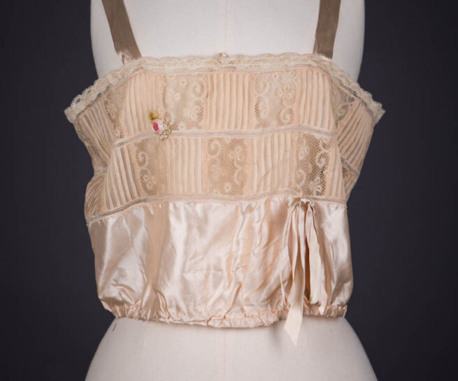 Peach Silk Satin, Pintucked Silk Georgette, Insertion Lace & Ribbonwork Corset Cover By Chamberlin-Johnson-DuBose Co., c. 1920s, USA. The Underpinnings Museum. Photography by Tigz Rice.