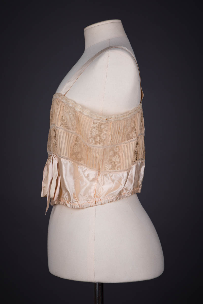Peach Silk Satin, Pintucked Silk Georgette, Insertion Lace & Ribbonwork Corset Cover By Chamberlin-Johnson-DuBose Co., c. 1920s, USA. The Underpinnings Museum. Photography by Tigz Rice.