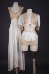 Trousseau Ensemble In Ivory Silk Satin, Ecru Lace Appliqué, Smocking & Satin Stitch Embroidery, c. 1930s, Spain. The Underpinnings Museum. Photography by Tigz Rice.
