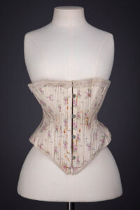 Floral Print Cotton Corset With Lace Ribbon Slot Trim By R. H. Macy & Co., c. 1890s, USA. The Underpinnings Museum. Photography by Tigz Rice.
