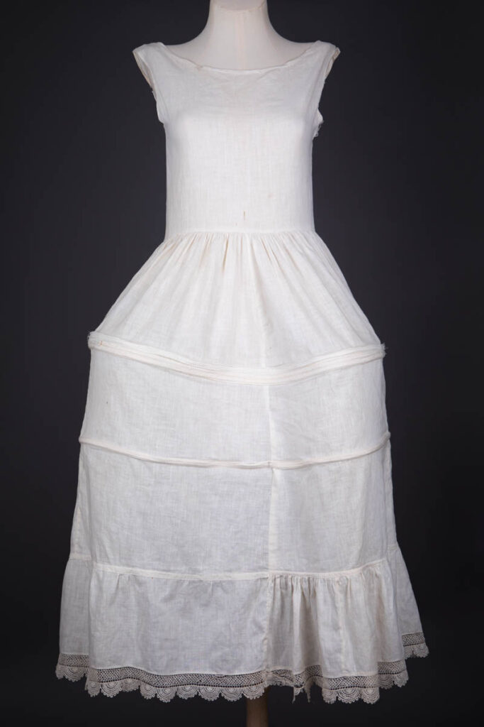 Cotton Underdress With Integrated 'Robe De Style' Panniers, c. 1920s. The Underpinnings Museum. Photography by Tigz Rice.