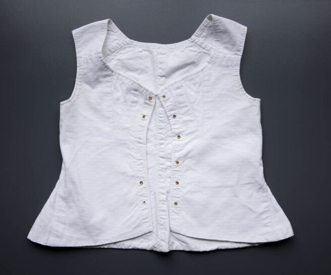 Cotton Young Teen's Front Lacing Corset, c. 1850-60s, France. The Underpinnings Museum. Photography by Tigz Rice.