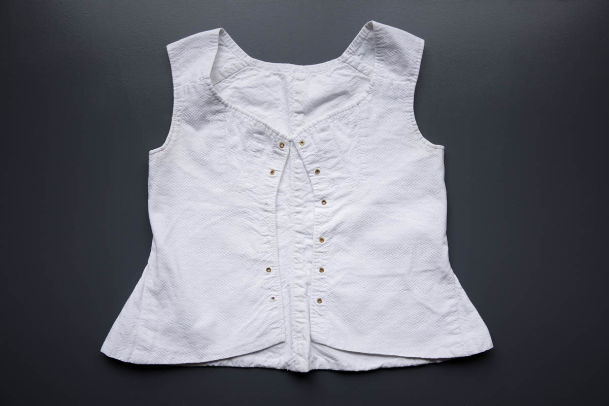 Cotton Young Teen's Front Lacing Corset, c. 1850-60s, France. The Underpinnings Museum. Photography by Tigz Rice.