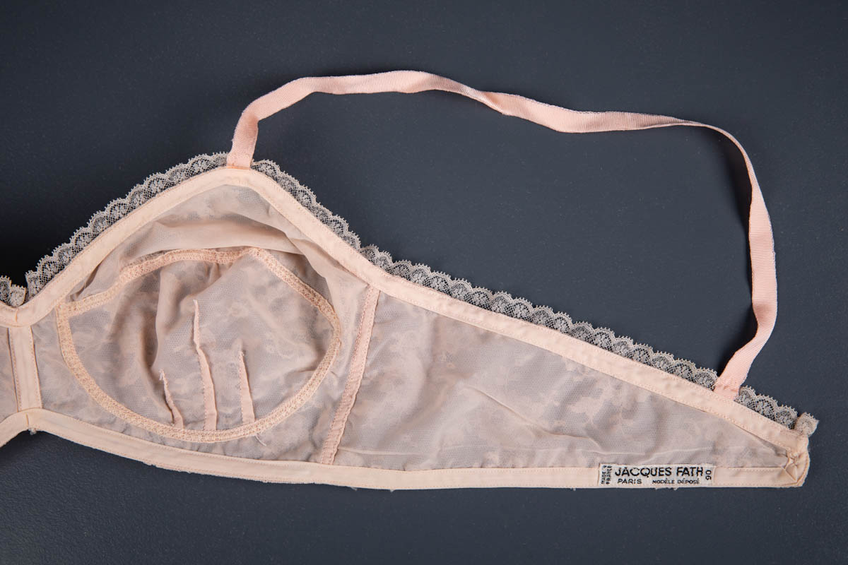 Pale Pink Nylon & Lace Bra With Ribbon Slot Trim By Jacques Fath, c. 1950s, France. The Underpinnings Museum. Photography by Tigz Rice.