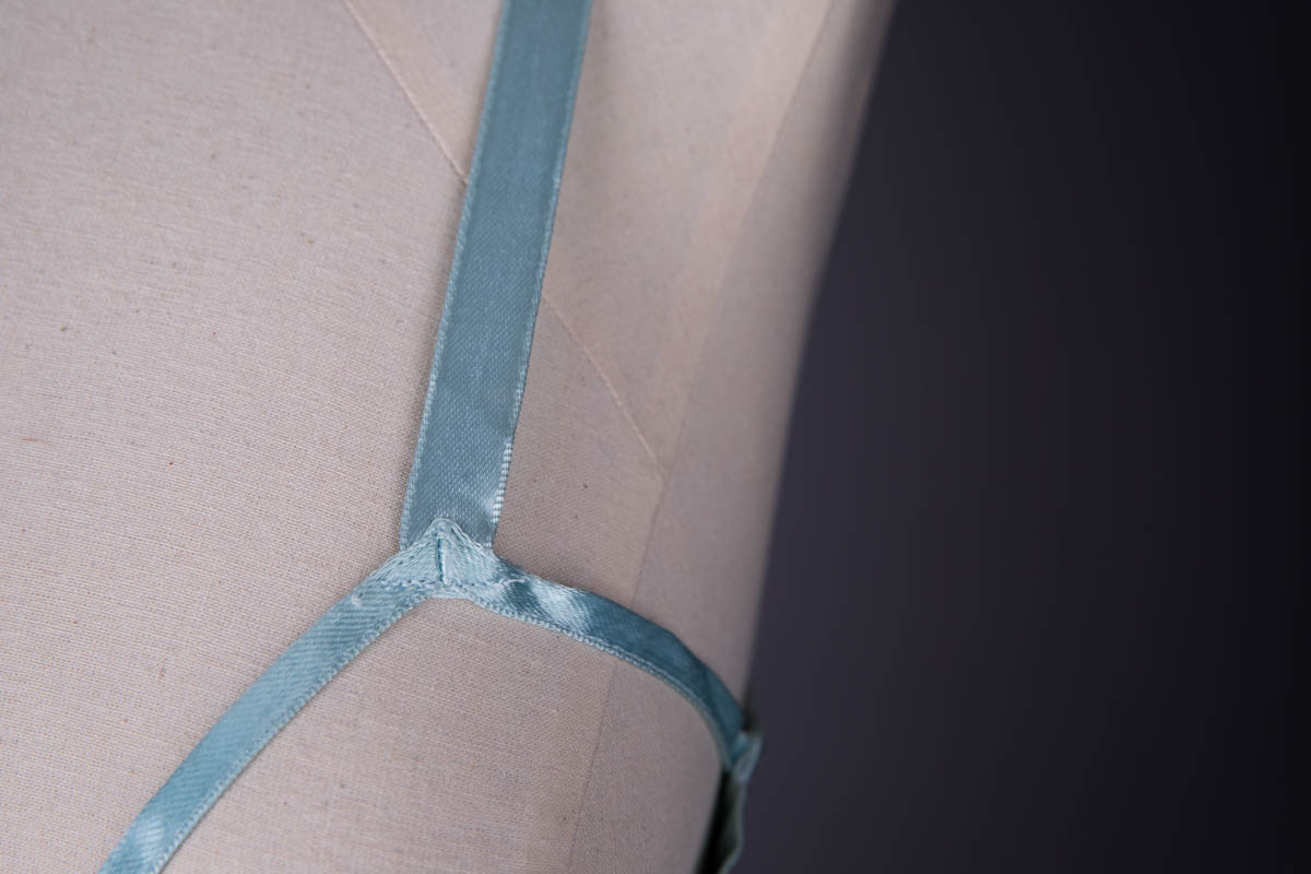 Pale Blue Satin Sling Bra By Charnaux, c. 1930s, Germany. The Underpinnings Museum. Photography by Tigz Rice.