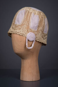Lilac Rayon Knit & Schiffli Embroidered Tulle Boudoir Cap, c. 1920s. The Underpinnings Museum. Photography by Tigz Rice.