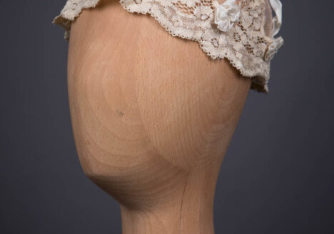 Beige Cotton Tulle Boudoir Cap With Ribbon & Machine Lace Trim, c. 1920s. The Underpinnings Museum. Photography by Tigz Rice.