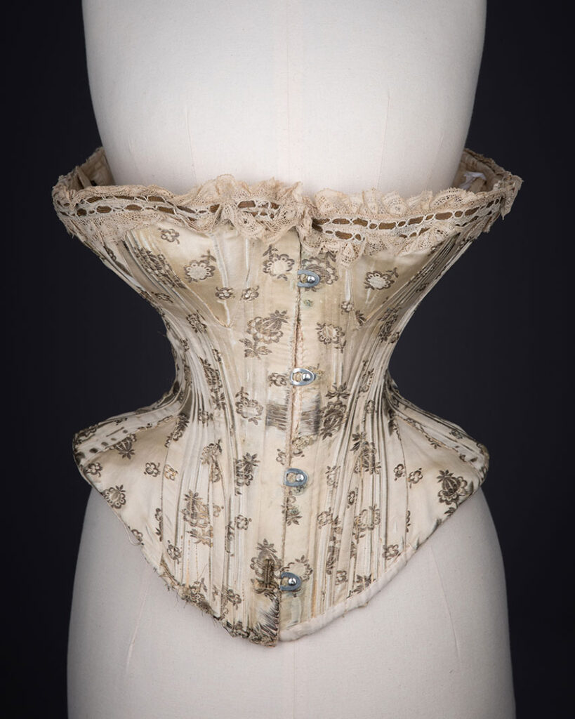 1900s Metal Brocade Curvy Midbust Corset. Photography by Tigz Rice. The Underpinnings Museum