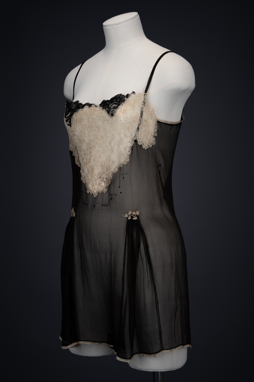 Black Silk Step In With Blonde Lace Appliqué By Chas A. Stevens & Bros, c. 1920s, USA. The Underpinnings Museum. Photography by Tigz Rice. Black Silk Step In With Blonde Lace Appliqué By Chas A. Stevens & Bros, c. 1920s, USA. The Underpinnings Museum. Photography by Tigz Rice.