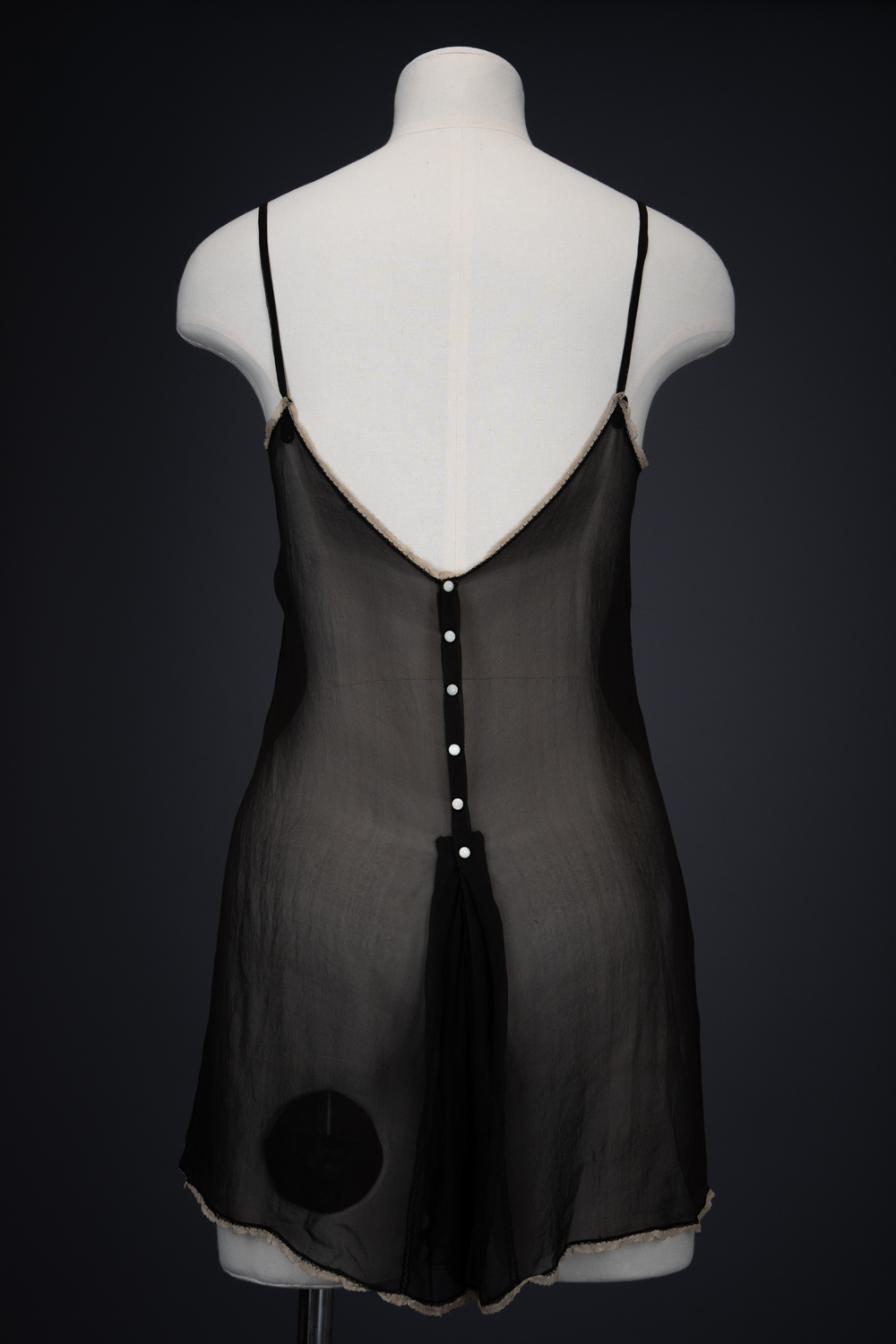 Black Silk Step In With Blonde Lace Appliqué By Chas A. Stevens & Bros, c. 1920s, USA. The Underpinnings Museum. Photography by Tigz Rice. Black Silk Step In With Blonde Lace Appliqué By Chas A. Stevens & Bros, c. 1920s, USA. The Underpinnings Museum. Photography by Tigz Rice.