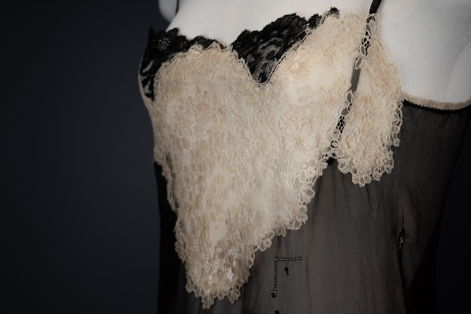 Black Silk Step In With Blonde Lace Appliqué By Chas A. Stevens & Bros, c. 1920s, USA. The Underpinnings Museum. Photography by Tigz Rice. Black Silk Step In With Blonde Lace Appliqué By Chas A. Stevens & Bros, c. 1920s, USA. The Underpinnings Museum. Photography by Tigz Rice.