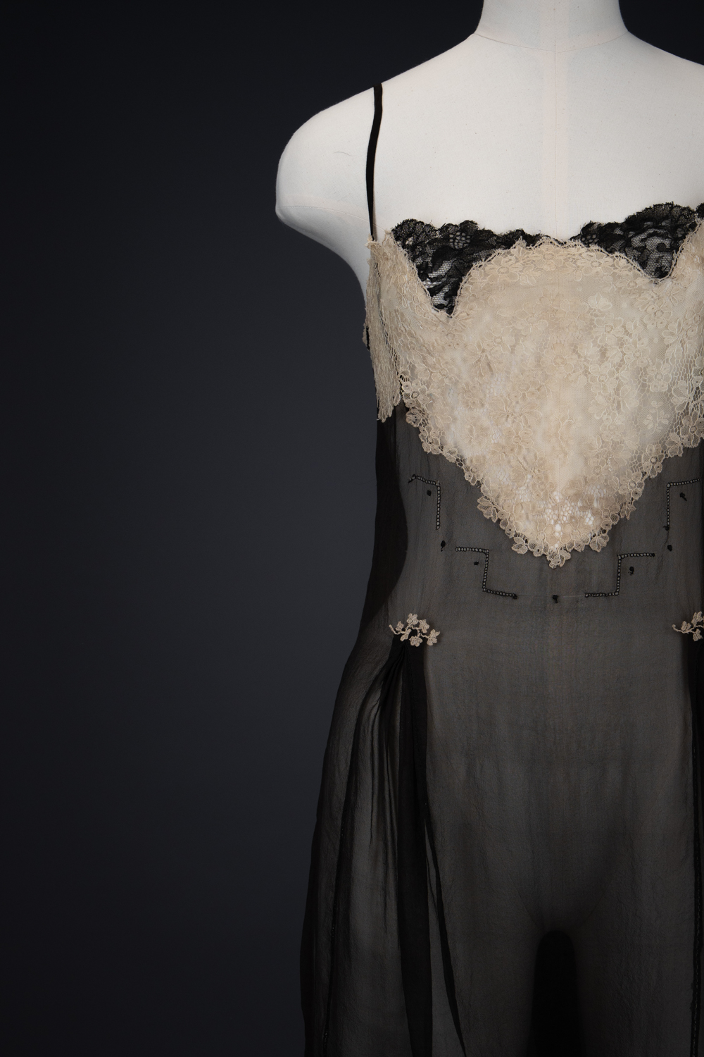Black Silk Step In With Blonde Lace Appliqué By Chas A. Stevens & Bros, c. 1920s, USA. The Underpinnings Museum. Photography by Tigz Rice. Black Silk Step In With Blonde Lace Appliqué By Chas A. Stevens & Bros, c. 1920s, USA. The Underpinnings Museum. Photography by Tigz Rice.