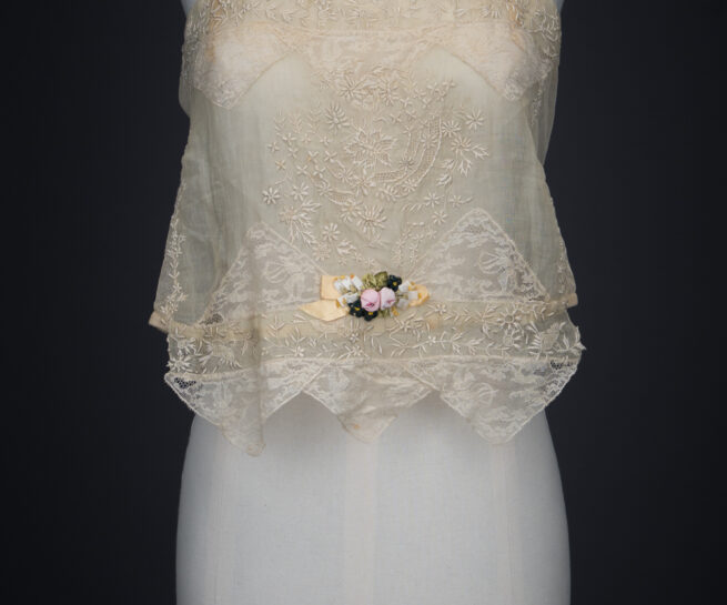 Embroidered Cotton Organdie Corset Cover With Machine Lace Trim & Silk Ribbonwork By Boué Soeurs, c. 1920s, France. The Underpinnings Museum. Photography by Tigz Rice.