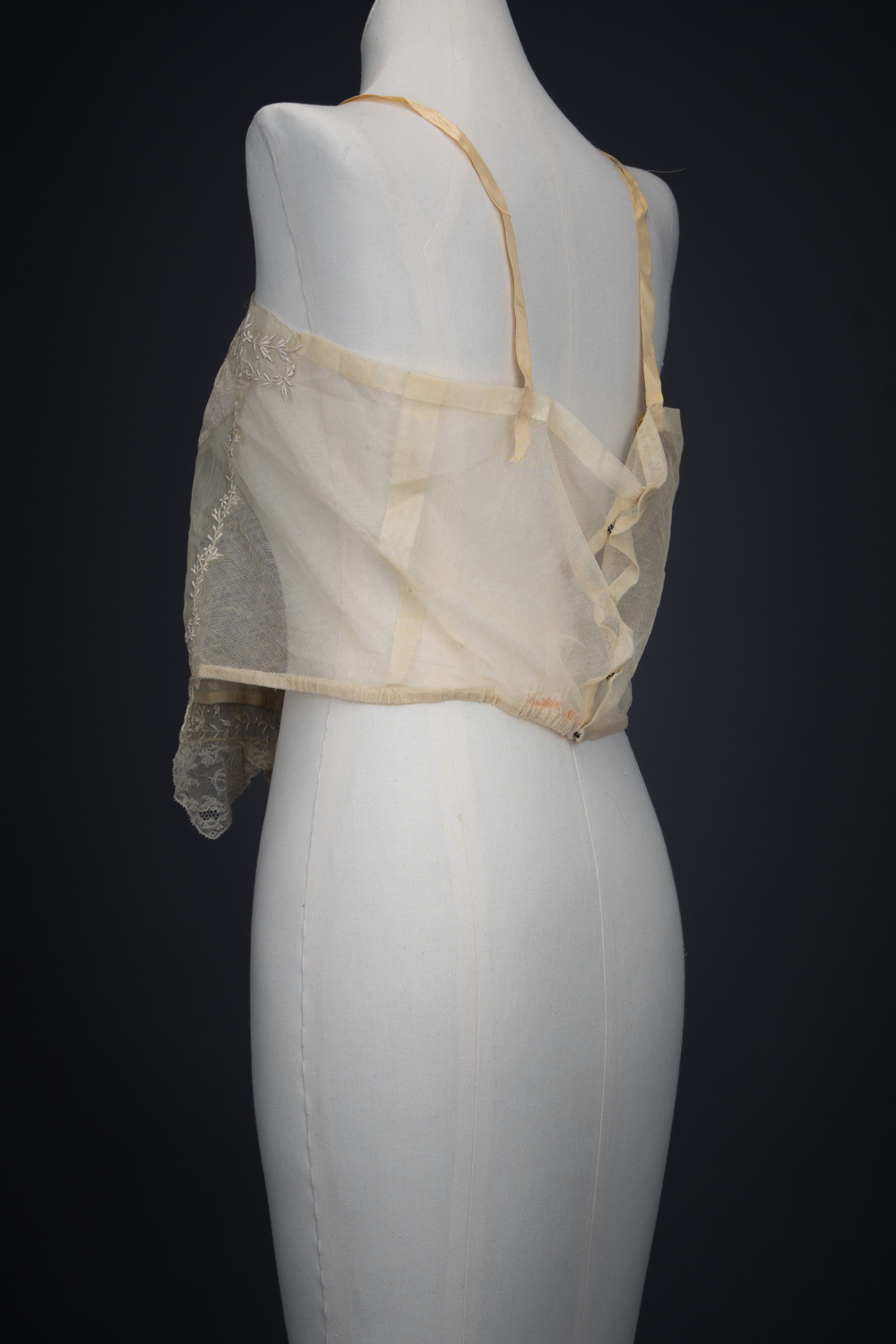 Embroidered Cotton Organdie Corset Cover With Machine Lace Trim & Silk Ribbonwork By Boué Soeurs, c. 1920s, France. The Underpinnings Museum. Photography by Tigz Rice.